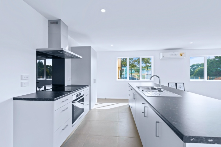 Modern Kitchen with white wall, celling and brown floor