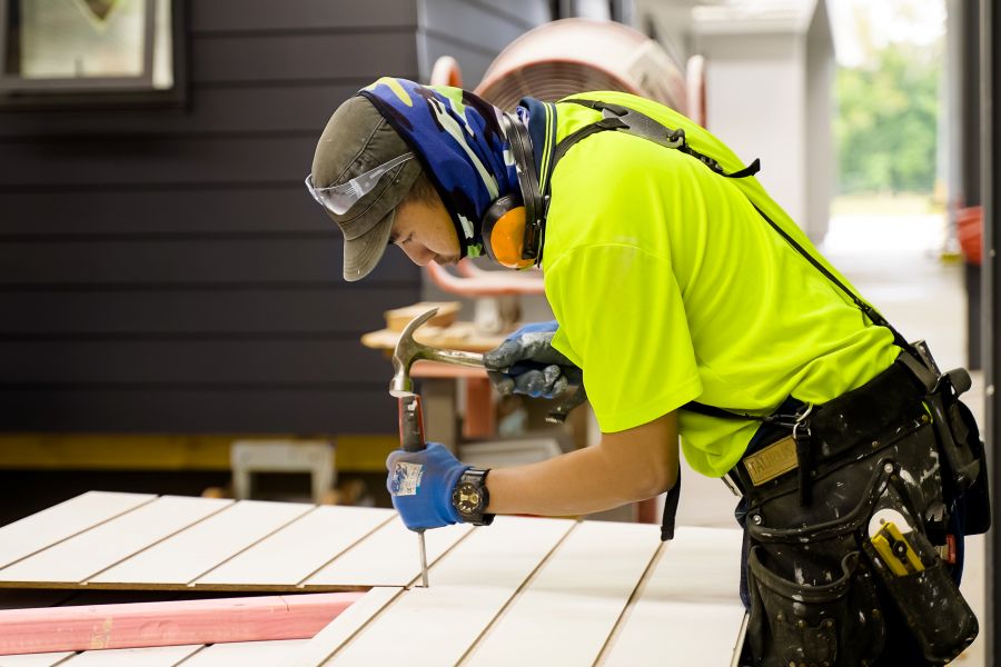 Advance Build builder working on cladding inside the Advance Build factory